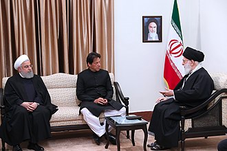 Khan with Ali Khamenei and Hassan Rouhani